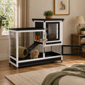 Mincy Pets 2-story rabbit hutch with black and white frame, chew-proof ramp, and leak-proof trays in a living room.