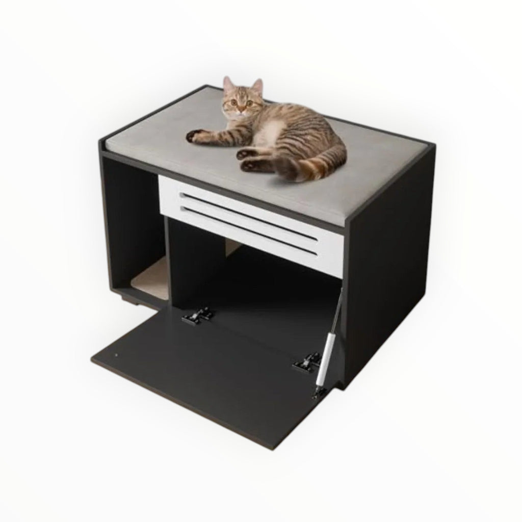 Mincy Pets cat litter box enclosure with a grey padded top, black cabinet, and white vent door, featuring a resting cat.