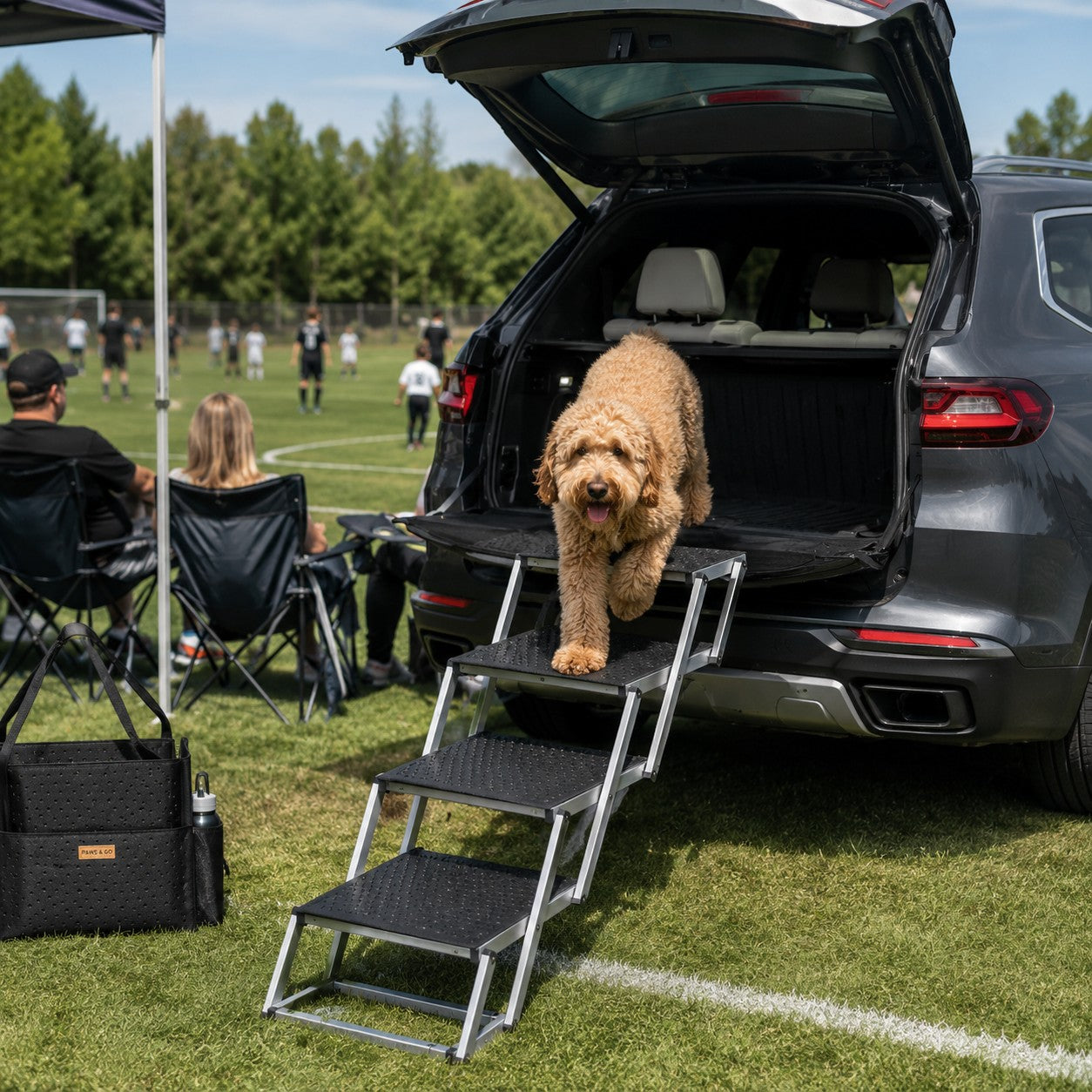 Mincy Pets folding 4-step aluminum dog stairs with non-slip Oxford surface, used by a dog to exit an SUV trunk.