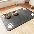 Mincy Pets grey absorbent pet feeding mat with herringbone pattern and white paw prints under two pet bowls