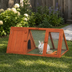 Mincy Pets orange wooden rabbit hutch with wire mesh run and a white bunny sitting inside on a grassy lawn.