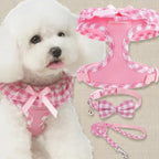 Mincy Pets pink gingham dog harness, collar with bow, and leash set worn by a white puppy