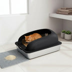 Mincy Pets stainless steel cat litter box with black lid, high walls, and grey litter mat in a modern home setting