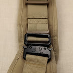 Mincy Pets tactical dog harness featuring a durable black metal quick-release buckle and tan nylon webbing straps.