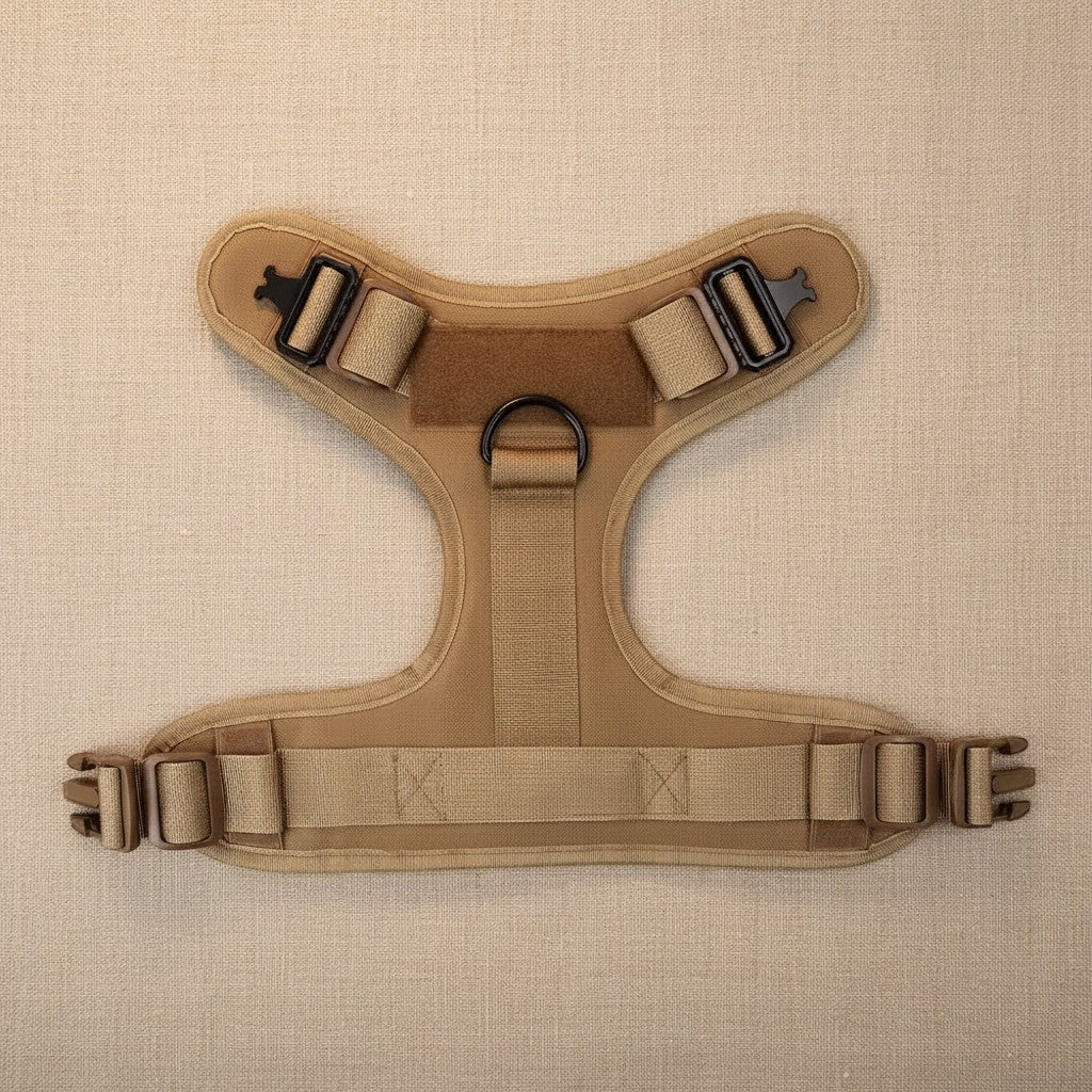 Mincy Pets tactical dog harness in tan nylon with metal buckles, adjustable straps, and a D-ring leash attachment point.