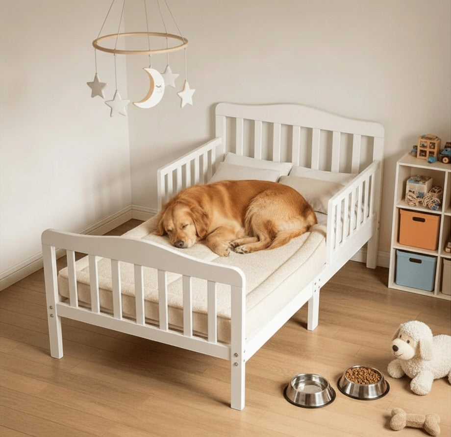 Mincy Pets white wooden toddler bed with safety guardrails and a golden retriever sleeping on a soft mattress
