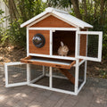 Mincy Pets 2-tier wooden rabbit hutch with a viewing bubble window, waterproof roof, and pull-out tray in a garden.