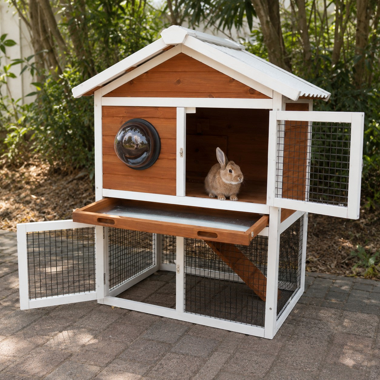 Mincy Pets 2-tier wooden rabbit hutch with a viewing bubble window, waterproof roof, and pull-out tray in a garden.