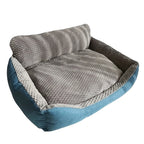 Mincy Pets XXL extra-large dog sofa bed with a grey plush interior and blue exterior, featuring a raised backrest.
